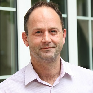 Headshot photograph of Jon Kingdon