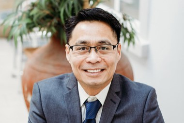 Headshot photograph of Neil Ecolango